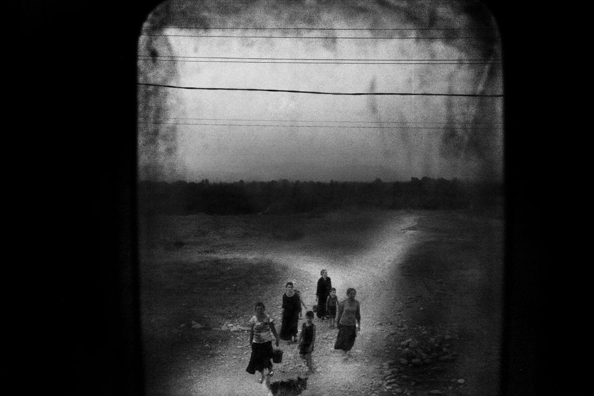 Women carrying water from a spring several kilometers away from their village. August. Tskhinvali Region.  Georgia